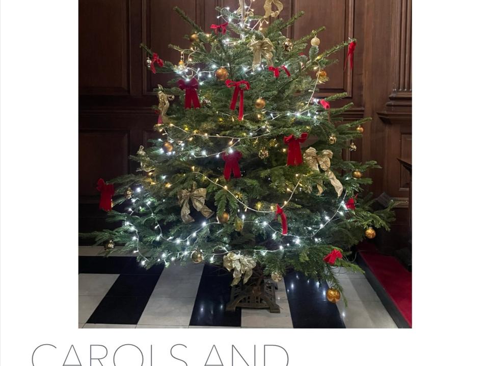 A Carols and Communion poster featuring a decorated Christmas tree.
