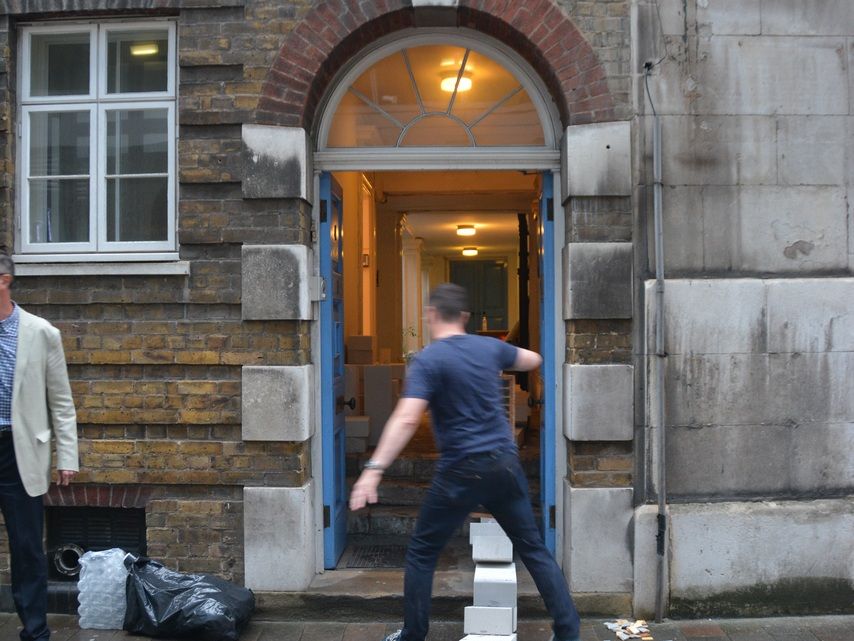 White blocks leading up to and through an open doorway.