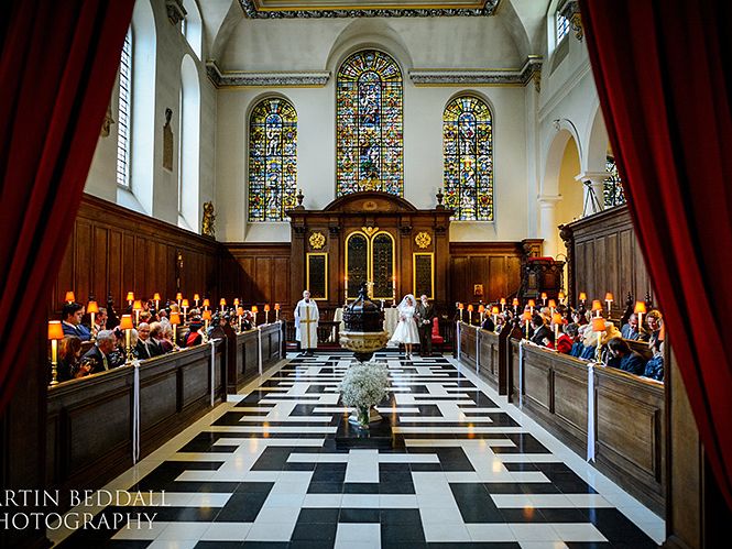 The wedding congregation and patterned aisle viewed towards the altar.