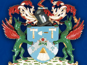 A colourful heraldic coat of arms with the motto Let Brotherly Love Continue.
