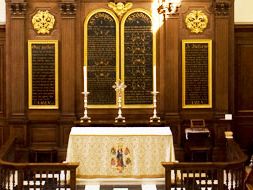 The altar and gilded reredos at the east end of the church.
