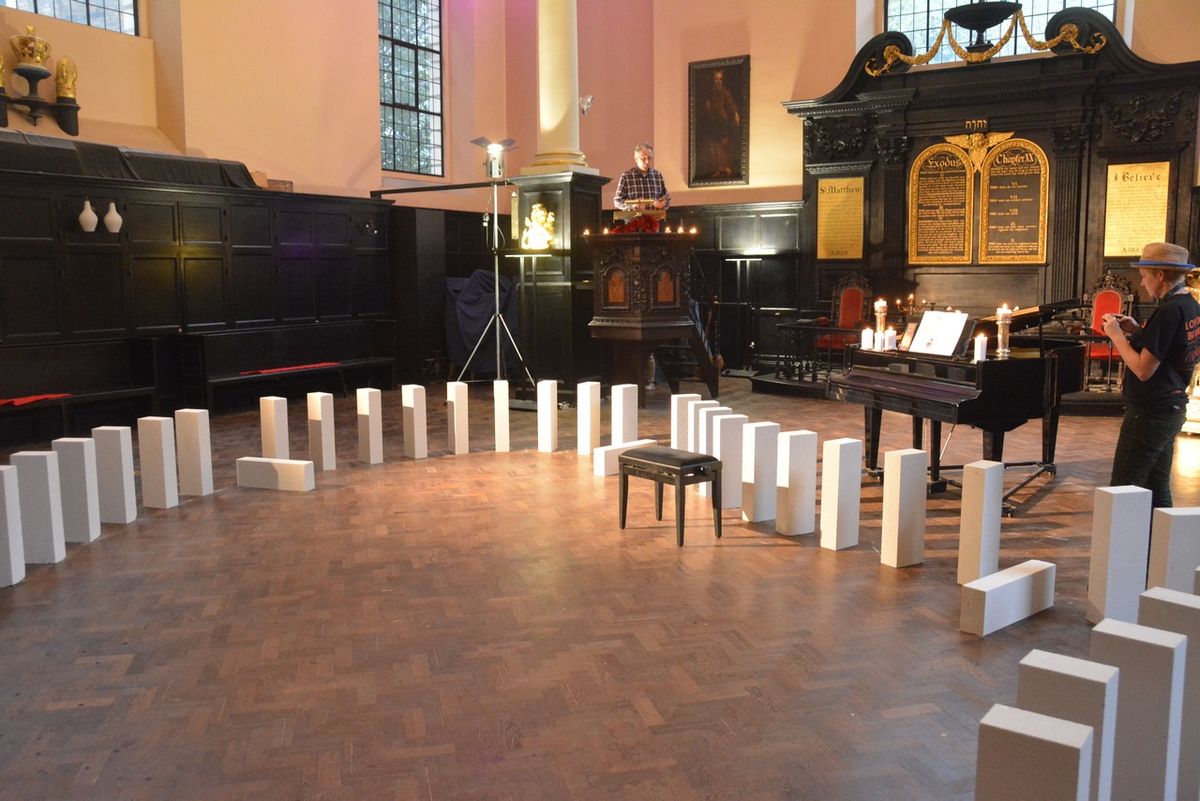Large white blocks forming a curve inside the church near the altar.