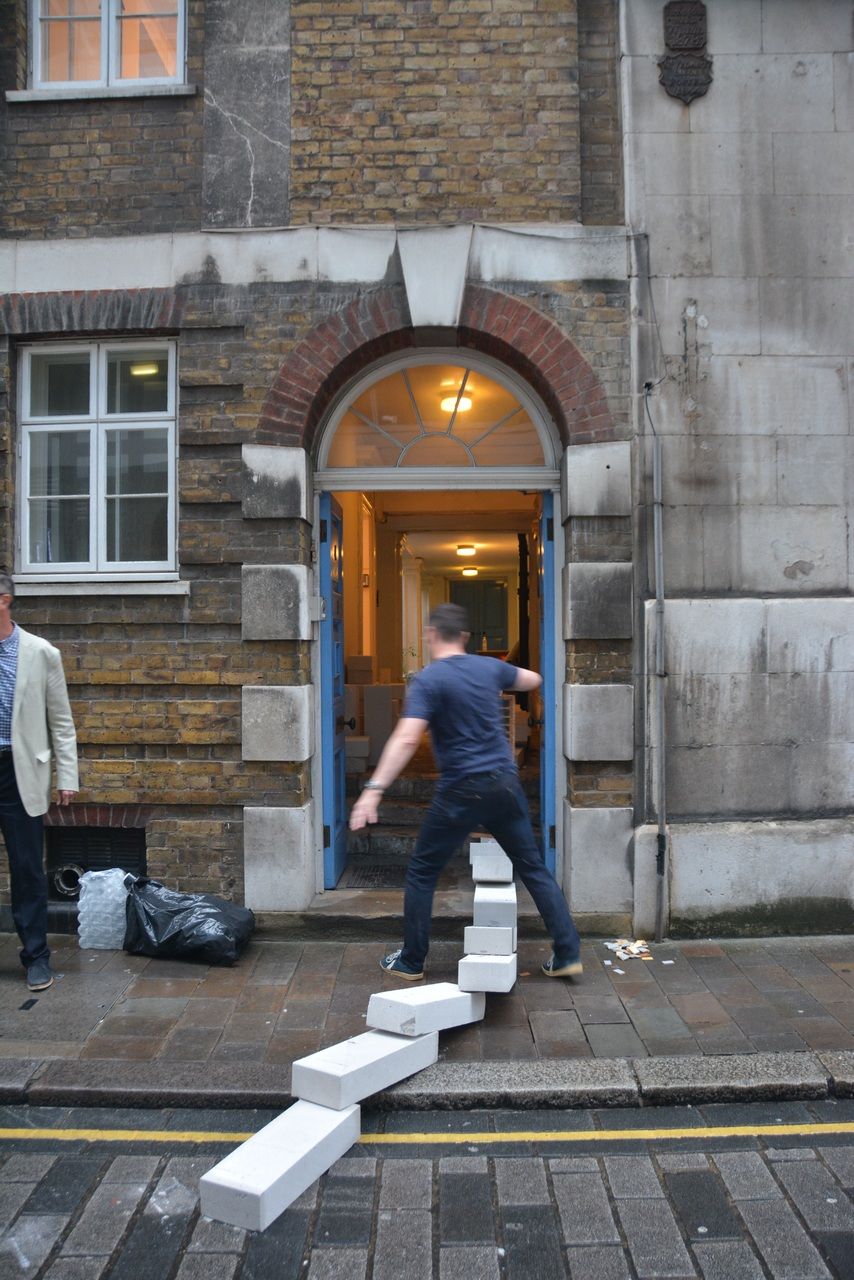 White blocks leading up to and through an open doorway.