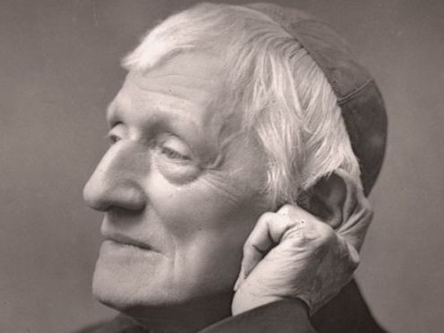 A black-and-white portrait of an older man resting his head on his hand.